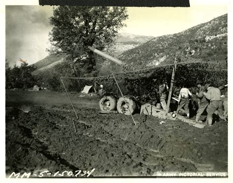 Mud Gun Italy|US artillery and troops in heavy mud, Cassino, Italy, 1943.